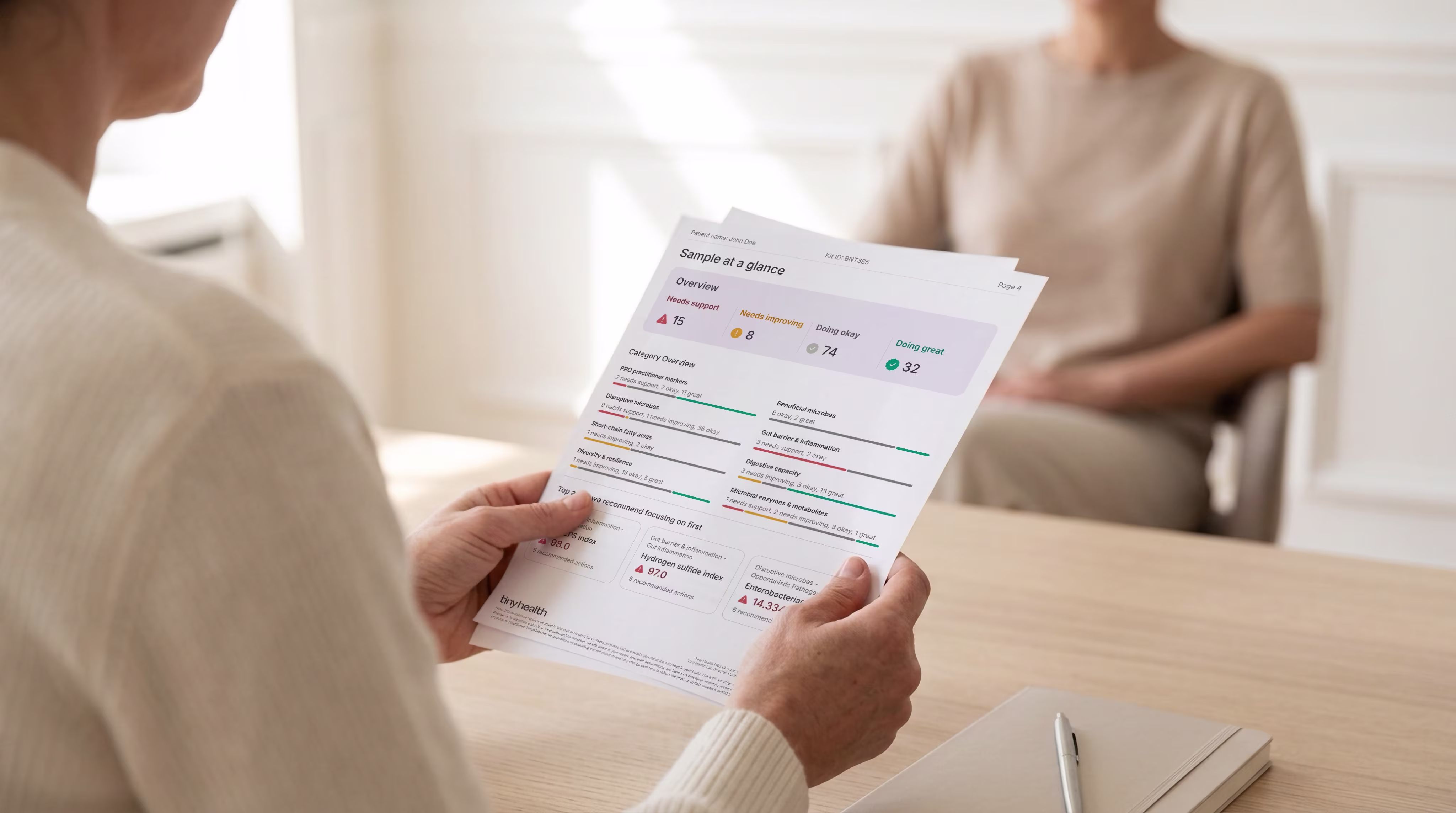 A person reviewing a Tiny Health sample report
